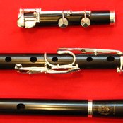 African Blackwood flute with 9 keys with it's separate flute joints, Head, Middle joint and foot joint