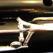 Close up of the right hand area of the flute in it's case with the head in the back