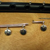 The Low B push is held in position with the end of the Low C# / C key Rod.